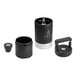 A black cylindrical VSSL Java G25 coffee grinder with a silver center and round metal handle.