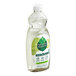A bottle of Seventh Generation Fresh Lime and Ginger dishwashing liquid with lime on it.