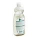 A close-up of a Seventh Generation Fresh Lime and Ginger dish soap bottle with a white label.