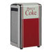 A Tablecraft "Have A Coke" tallfold napkin dispenser on a countertop with a red and white design.