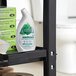 A shelf with a white Seventh Generation toilet bowl cleaner with a green label.