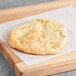 A large fry bread on a wooden board.