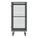 A gray metal security cart with shelves and a cage on wheels.