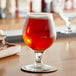A glass of Endless Harvest Raspberry fruit puree on a table.
