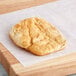 A Brian's Fabulous FryBread on a wooden cutting board.