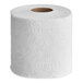 A Seventh Generation toilet tissue roll on a white surface.