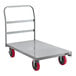 A metal platform truck with red wheels.