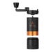 A VSSL Java G25 carbon hand coffee grinder with black and gold accents and a black cylinder.