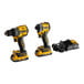 A yellow and black DeWalt cordless drill and impact driver kit with batteries and charger.