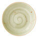A round, green ceramic coupe bowl with a subtle swirl pattern and rustic speckled accents.