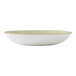 A shallow, round, green coupe bowl with a slightly rustic finish.