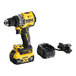 A yellow and black DeWalt 20V MAX XR cordless drill with a black battery charger.