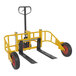 A yellow and black Vestil steel manual pallet truck with wheels and a handle.