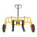 A yellow and black Vestil steel manual pallet truck with two wheels.