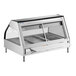 A stainless steel countertop heated display case with glass sliding doors and multiple food pans.