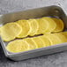 A baking pan filled with Papetti's Fully Cooked Scrambled Egg Patties on a table in a hotel buffet.