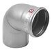 A silver stainless steel pipe elbow with a red label.
