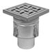 A BLUCHER stainless steel square floor drain with a square drain cover.