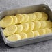 A tray of Abbotsford Farms round yellow scrambled egg patties.