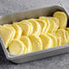 Papetti's Egg Omelet in a tray on a school kitchen counter with a yellow cloth.