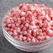 A bowl of pink and white Kraft Mini Dehydrated Marshmallows.