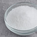 A bowl of Hometown Provisions Coarse Sea Salt on a table.