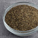 A bowl of Hometown Provisions Table Grind black pepper on a table.