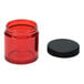 A red Comandante jar with a black lid.