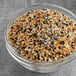 A bowl of mixed grains including seeds and nuts.