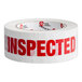 A white Tape Logic roll of tape with red "Inspected" text.