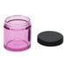 A pink plastic Comandante jar with a black lid.