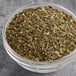 A bowl of Hometown Provisions dried basil leaves.