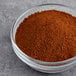 A bowl of Hometown Provisions Chili Powder on a gray surface.