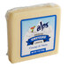 An Alps Natural Gruyere Cheese block with a label wrapped in plastic.