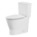 An American Standard white floor mount toilet with lid down.