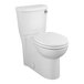 An American Standard white floor mount toilet with the seat down.