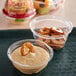 A plastic tray with a bowl of Sabra Classic Hummus and Rold Gold pretzels.