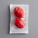 A package of Martin's PA Dutch pickled red beet hard cooked eggs with two red eggs inside.