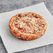 A Red Baron Deep Dish Meat Trio pizza on a plate.