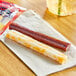 A Jack Link's Colby Jack cheese stick and beef stick on a napkin.