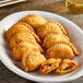 A plate of Cuisine Innovations Chicken Empanadas.