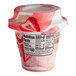 A Del Monte strawberry non-dairy yogurt parfait in a plastic container with a label.