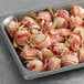 A tray of Cuisine Innovations bacon wrapped scallops.