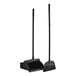 A black open-lid lobby dustpan with a long black pole and broom.