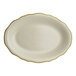 A white oval Homer Laughlin china platter with gold trim.
