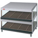 A Hatco slanted double shelf merchandiser with three shelves holding food.