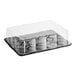 A D&W Fine Pack plastic container with a clear scalloped lid.