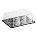 A D&W Fine Pack clear plastic cake display container with a clear scalloped lid.