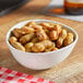 A bowl of Peanut Patch Cajun boiled peanuts on a table.