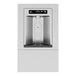 A Haws stainless steel surface mount bottle filler over a rectangular window with a bottle inside.